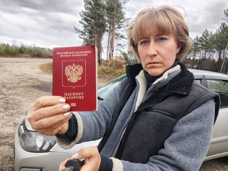 Driver girl with Russian passport and car. Russian cars banned for entering in Europe. Russian tourism closed during war of Russia and Uk. Confiscation of Russian car and sanctions against Russians