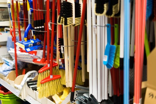 Large assortment of brushes for cleaning premises in store. Trade in floor cleaning equipment