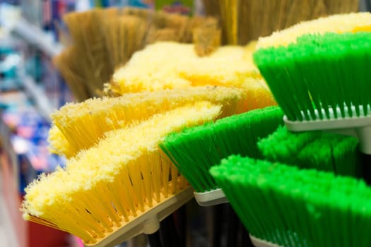 Large assortment of brushes for cleaning premises in store. Trade in floor cleaning equipment