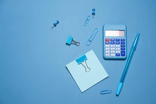 School objects, office supplies, tools and accessories isolated on blue background. Education concept