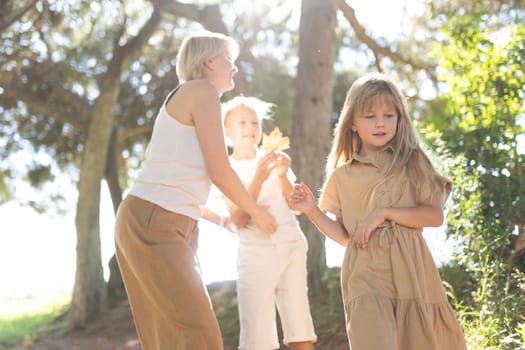 Kids enjoying a playful moment in a sunny forest environment