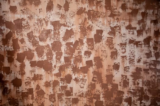 An intriguing abstract texture that showcases a beautifully warm brown color palette and a unique distressed appearance