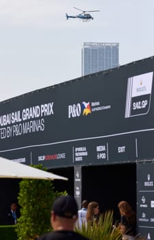 UAE, Dubai, 23 November 2024: visitors stand in line to enter the Rolex Sail GP Grand Prix international sailing competition using high performance F50 foiling catamarans. High quality photo