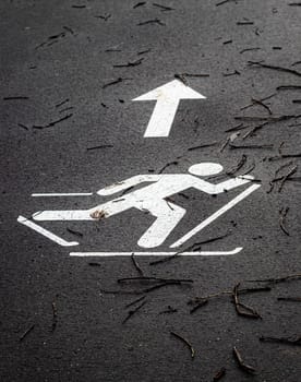 Shot of the paint marking on the asphalt indicating skiing path