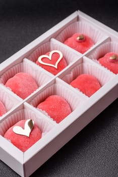 Delicious sweet mochi in the shape of red hearts for the holiday of Valentine's Day