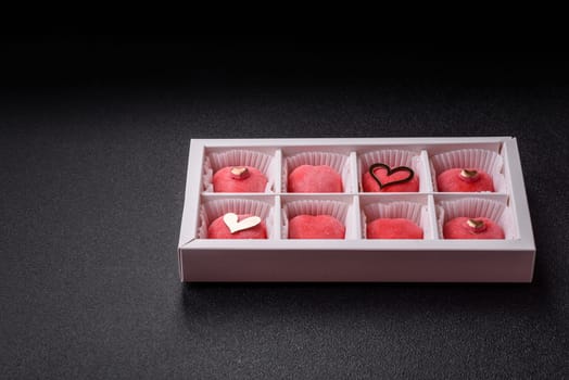 Delicious sweet mochi in the shape of red hearts for the holiday of Valentine's Day