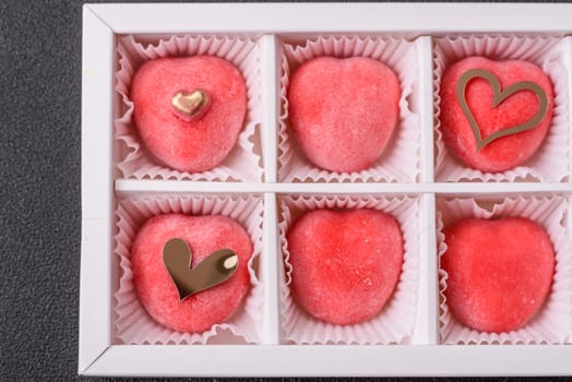 Delicious sweet mochi in the shape of red hearts for the holiday of Valentine's Day