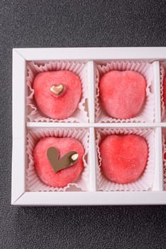 Delicious sweet mochi in the shape of red hearts for the holiday of Valentine's Day