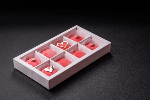 Delicious sweet mochi in the shape of red hearts for the holiday of Valentine's Day