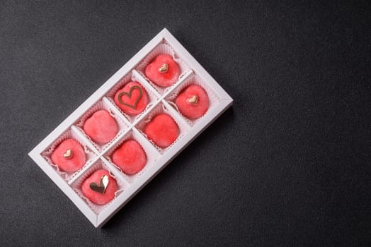 Delicious sweet mochi in the shape of red hearts for the holiday of Valentine's Day
