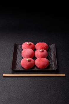 Delicious sweet mochi in the shape of red hearts for the holiday of Valentine's Day