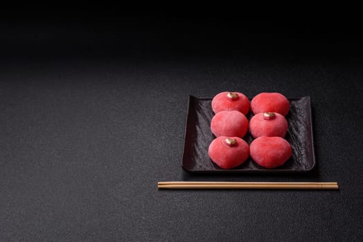 Delicious sweet mochi in the shape of red hearts for the holiday of Valentine's Day