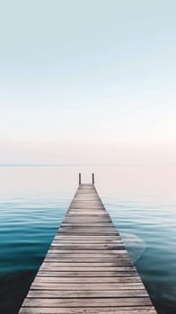 The wooden dock stretches out into the still, clear waters, reflecting the soft colors of dawn, creating a peaceful atmosphere perfect for relaxation - Generative AI