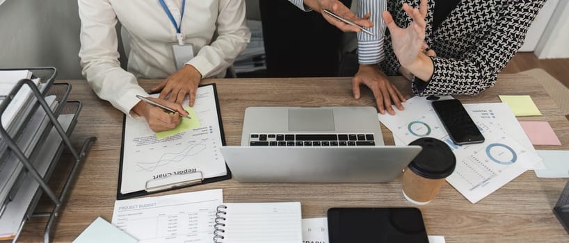 A business team engages in collaboration sharing ideas and strategies during an important office meeting.
