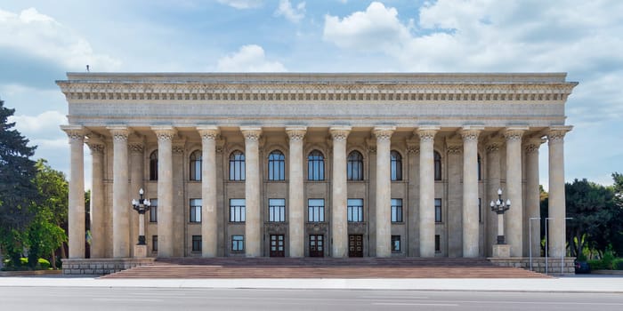 Baku, Azerbaijan - May 10, 2024: Wide shot of the Museum Center in Baku. The building has a classical facade with columns and a dome, and is located on Neftchiler Avenue