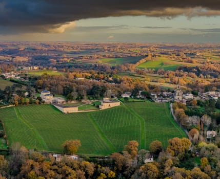 France, Gironde, Tabanac, Aerial view of the vineyard and wooded areas of Chateau le Pic in the Bordeaux vineyards at sunset. High quality photo