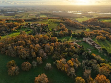 France, Gironde, Tabanac, Aerial view of the vineyard and wooded areas of Chateau le Pic in the Bordeaux vineyards at sunset. High quality photo