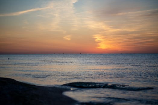 bebeautiful seascape with bright horizon. sun over sea painted sky red and goldautiful seascape with bright horizon. High quality photo