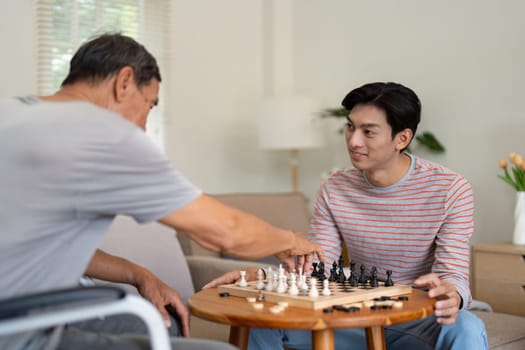 A father and son share a strategic chess match, highlighting their bond and the joy of quality time spent together in a warm home environment.