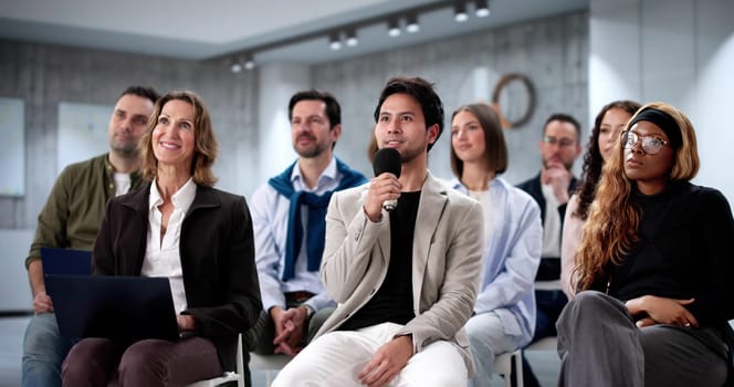 Focused Businessman Engaged in Learning at Diverse Seminar Event