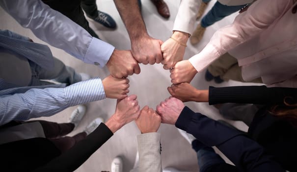 Business Team United in Effort to Stack Hands in Circle