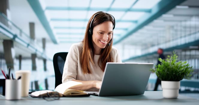 Virtual Business Chat: Female Executive Writing Notes During Online Conference.