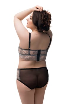 Young fat brunette in black lace lingerie cropped rearview