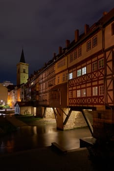 The Kramerbrucke with the river Gera in the old town of Erfurt in Germany at night