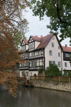 Idyllically situated residential buildings on the River Gera in the city center of Erfurt in the federal state of Thuringia, Germany