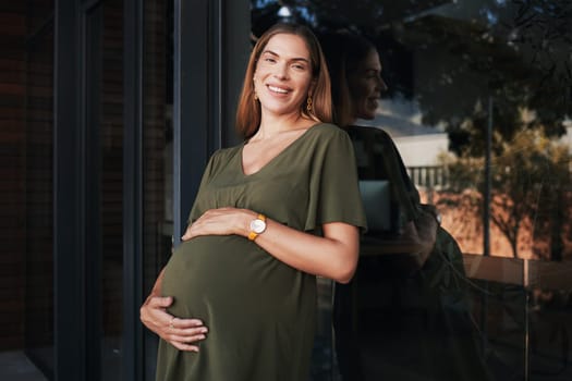 Portrait, smile and a business pregnant woman on the balcony at her office, excited about maternity leave from work. Company, stomach and pregnancy with a happy young employee at the workplace.