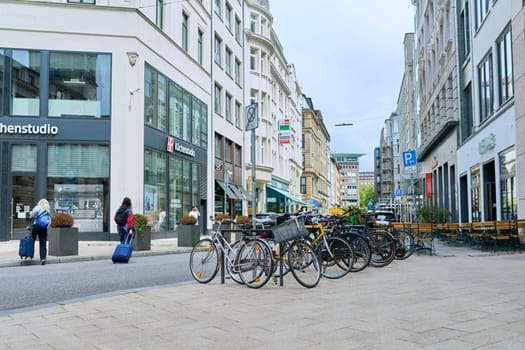 Hamburg, Germany, 1.08.2023, Hamburg streets, pedestrians, people, architecture, roads, transport, parked bikes.