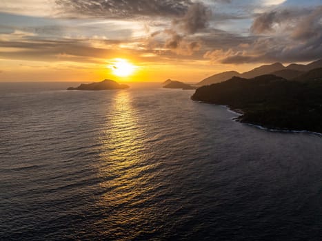 Colorful sunset and tropical islands. Seychelles, Mahe.