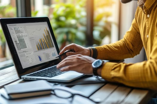 A business executive analyzes important data on a laptop to enhance energy efficiency. The workspace features charts and graphs showcasing trends and insights.
