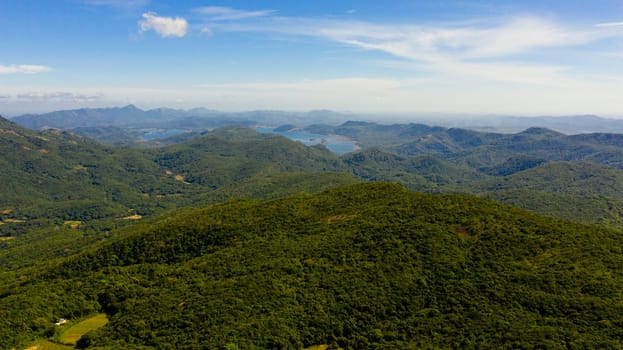 Aerial drone of Mountains with rainforest and jungle in the mountainous province of Sri Lanka. Riverston, Sri Lanka.