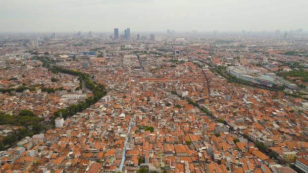 Aerial cityscape modern city Surabaya with skyscrapers, buildings and houses. urban environment in asia city skyline with skyscrapers and business centers java, indonesia