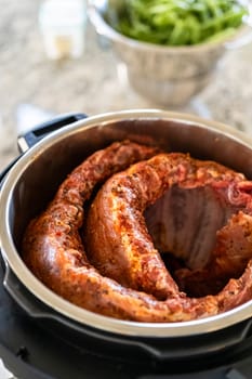 In a sleek modern kitchen, we Are adding an extra layer of flavor to succulent baby back ribs by infusing them with a medley of spices in a multicooker-a mouthwatering feast in the making.