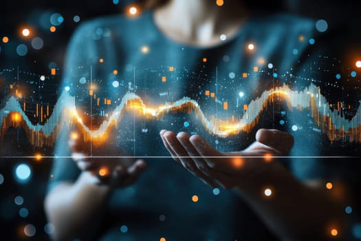 A woman is holding a hand up to a screen displaying a graph. The graph is filled with orange and blue lines, and the woman's hand is holding it up to the screen. Concept of excitement and curiosity
