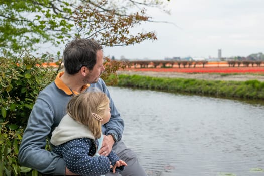 Father and daughter enjoy in Keukenhof park.