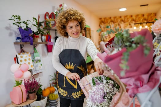 In a charming flower shop filled with colorful blooms, a joyful floral artist arranges fresh bouquets with care. The warm atmosphere reflects creativity and passion for nature's beauty.