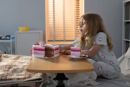 A young girl enjoys a cozy, delightful morning filled with delicious sweets in a softly lit, warm bedroom