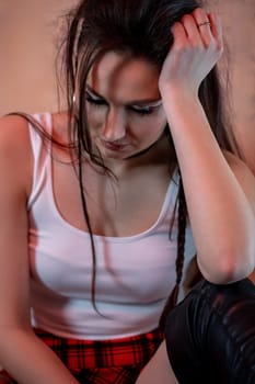 A young woman, deeply lost in her thoughts, captures her evolving emotions in a beautifully casual atmosphere