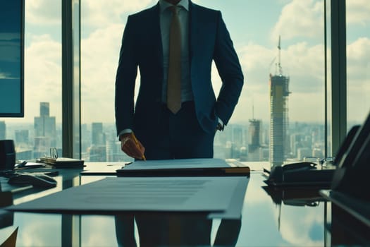 A man in a suit is writing on a piece of paper at a desk. Concept of professionalism and focus, as the man is dressed in a suit and tie and he is working on important documents