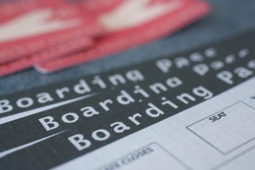 Close-up of a boarding pass with travel details and instructions.
