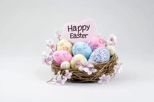 Colorful Easter eggs in basket on tabletop, .happy Easter day concept. Space for text on white background.