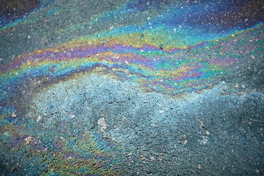 Iridescent oil spill generating a stunning, abstract pattern full of vivid colors