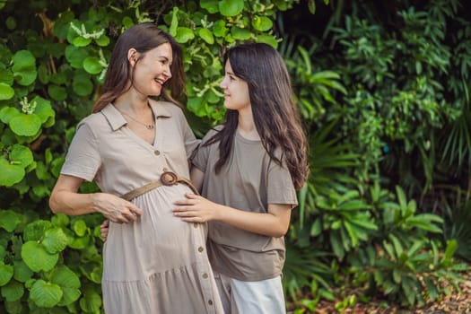 A heartwarming moment captured in the park as a pregnant woman after 40 shares a special bond with her teenage daughter, embracing the beauty of mother-daughter connection.