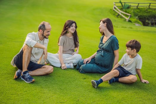 A loving family enjoying a leisurely walk in the park - a radiant pregnant woman after 40, embraced by her husband, and accompanied by their adult teenage children, savoring precious moments together amidst nature's beauty. Pregnancy after 40 concept.