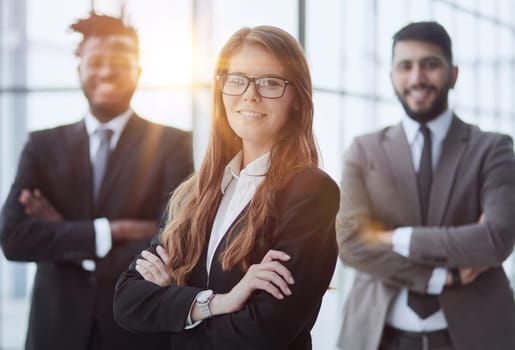 Beauty and men. three office workers are smiling and looking at the camera.