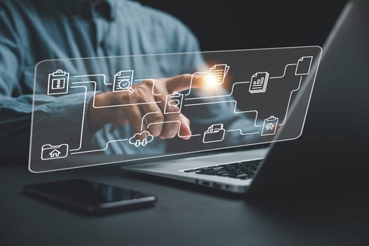 Businesswoman pointing to a virtual modern screen displaying Document Management System (DMS). Concept of digital file management and efficient information handling. Internet-based technology.