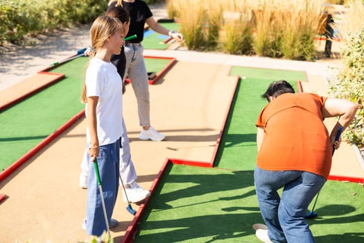 Minigolf player detail on green grass. High quality photo